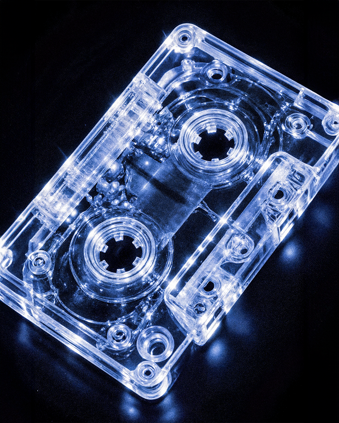 enhanced_a_futuristic_transparent_blue_cassette_tape_hyperrealistic_op9xd1848x5emg3zlf4l_3